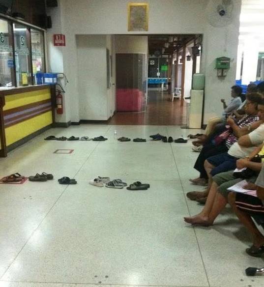 Using shoes to queue in Thailand